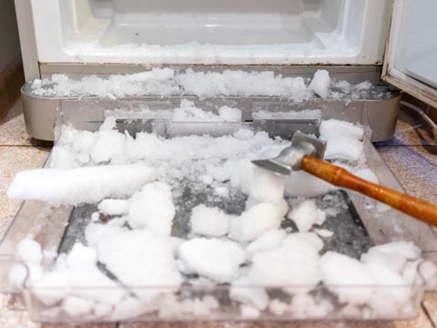 Freezer ice build up chopped out into a tray